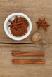 Spices and ramekin on wood