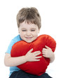 Boy cuddling heart