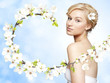 Gorgeous young blond woman with spring flower branch Gorgeous young blond woman with spring flower branch