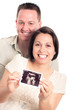 Photo: Happy pregnant couple with ultrasound picture Happy pregnant couple with ultrasound picture