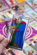 L'Hermite, Tarot card held in the hand L'Hermite, Tarot card held in the hand