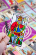 Le Pape, Tarot card held in the hand Le Pape, Tarot card held in the hand