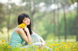 Cute woman in the park with dandelions Cute woman in the park with dandelions