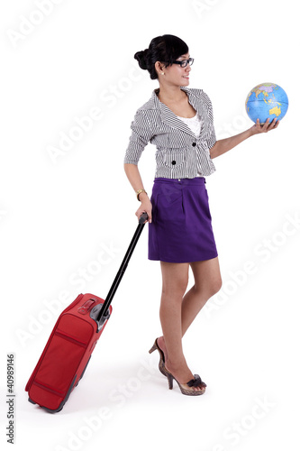 Photo: Businesswoman with suitcase and a globe Businesswoman with suitcase and a globe