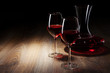 two Wine glass and decanter on a wooden table