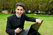 Young man with cell phones and laptop. Young man with cell phones and laptop.