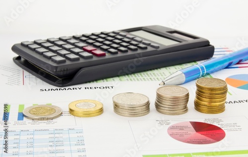 Photo: Coins stack on colorful business background Coins stack on colorful business background