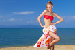canvas print picture - Adorable woman standing at the tropical beach
