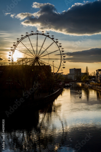 Photo: Funfair reflection in river at sunset Funfair reflection in river at sunset