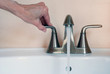 turning on faucet