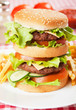 Double hamburger with cheese, lettuce and tomato Double hamburger with cheese, lettuce and tomato