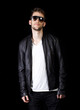 Photo: Portrait of young handsome man wearing sunglasses Portrait of young handsome man wearing sunglasses