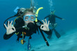 Photo: man and woman scuba dive togeather man and woman scuba dive togeather