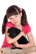Girl with small puppy dog