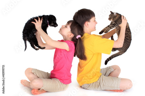 Photo: Children with family pets. Children with family pets.