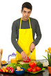 Chef man cutting red pepper