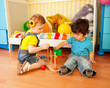 boy and girl playing with toy pyramid puzzle