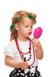 Little girl making up her face