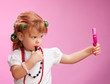 Little girl playing with mothers makeup