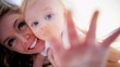 Blonde Mom and Baby Playing Indoors