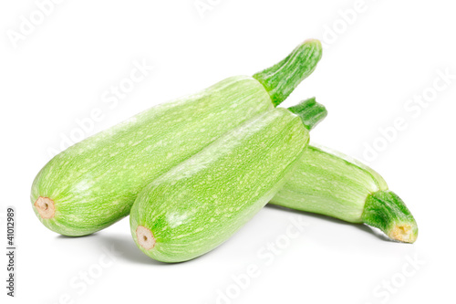 Photo: Green fresh Zucchini isolated on white background Green fresh Zucchini isolated on white background