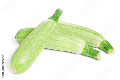 Photo: Green fresh Zucchini isolated on white background Green fresh Zucchini isolated on white background