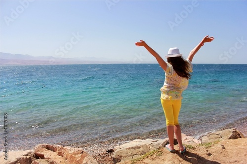 Photo: a young girl on the beach a young girl on the beach