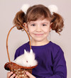 little girl holding a basket with dwarf white bunny little girl holding a basket with dwarf white bunny