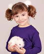 little girl holding cute dwarf bunny little girl holding cute dwarf bunny