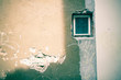ld window of an abandoned rural house