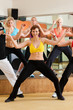Zumba or Jazzdance - young people dancing in studio