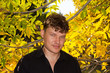 man in a black shirt on the background of autumn man in a black shirt on the background of autumn