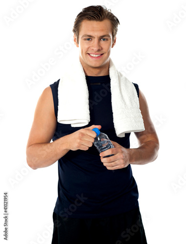 Photo: Young athlete posing with water bottle Young athlete posing with water bottle