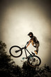 Young man flying on his bike: Dirt jump