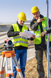 Geodesist read plans on construction site