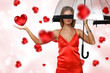 Pretty young woman with umbrella and hearts