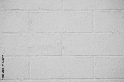 Photo: Brick wall painted with a white paint Brick wall painted with a white paint