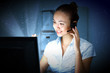 Young woman in business wear and headset