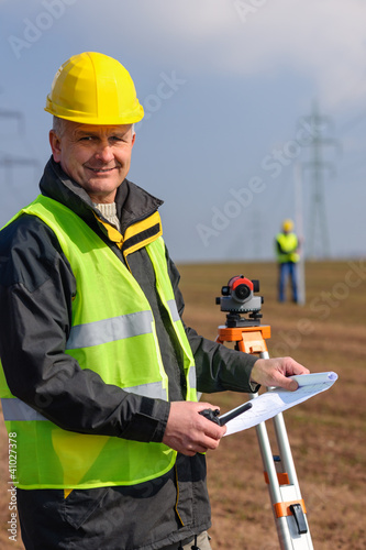 Photo: Geodesist measure land hold construction plans Geodesist measure land hold construction plans
