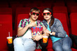 Young couple in cinema watching movie