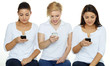 Foto: Three girls are sending an SMS on white background Three girls are sending an SMS on white background