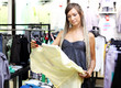 Young girl buying clothes Young girl buying clothes