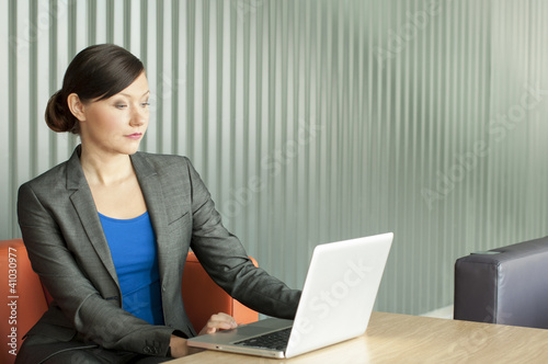 Photo: Business woman using a laptop Business woman using a laptop