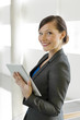 Photo: Business woman using a tablet computer Business woman using a tablet computer