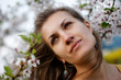 Young woman with spring flowers of sakura Young woman with spring flowers of sakura