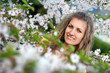 Young woman with spring flowers of sakura Young woman with spring flowers of sakura