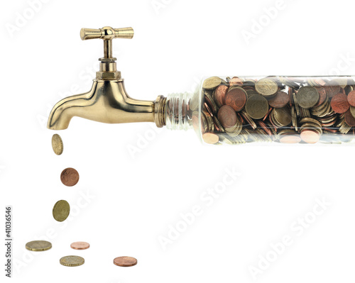 Photo: Money coins fall out of the golden tap Money coins fall out of the golden tap
