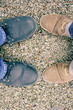 two pairs of boots on ground background