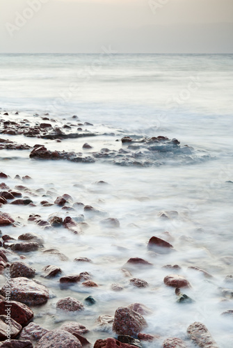 Photo: cobble stone beach of Read Sea on sunset cobble stone beach of Read Sea on sunset