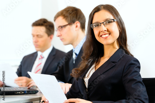 Photo: Business people during meeting in office Business people during meeting in office